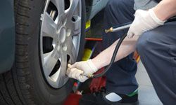 Checking air pressure in car tire