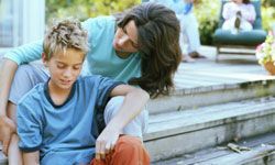 Mom talking to young son on deck