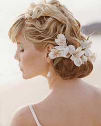 Adding a few waves to your hair may help you beat the heat, even if you're saying "I do" at the beach.