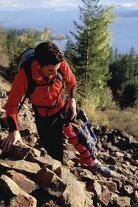 This injured hiker has made a homemade splint to help make his way to safety. 