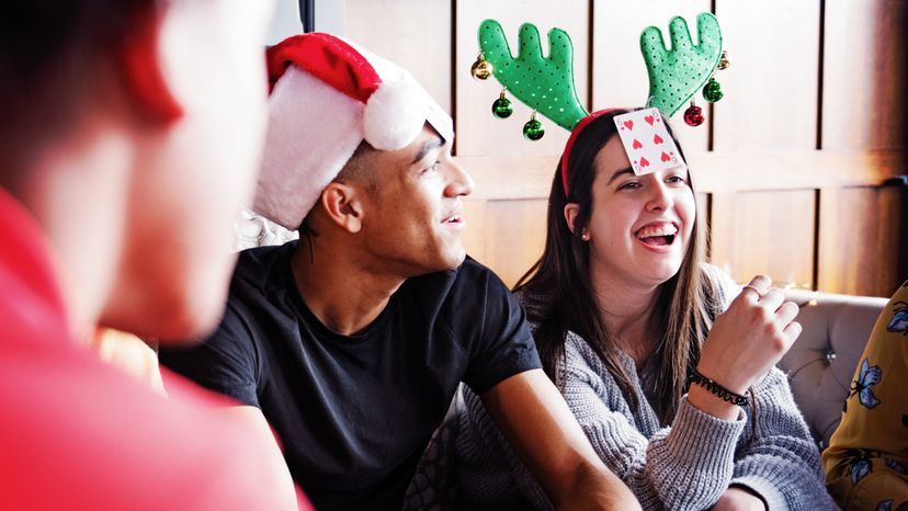 Male and female friends having a Christmas party. 