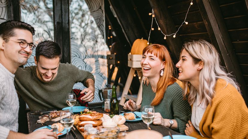 friends enjoy thanksgiving dinner