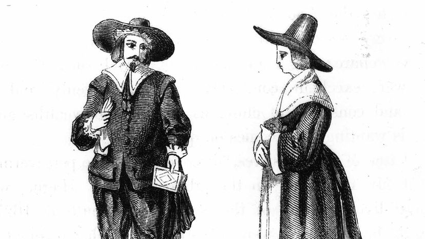couple in traditional Puritan dress.