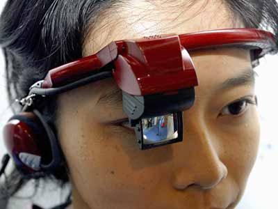 A woman wears Team Tsukamoto's prototype of a wearable PC.