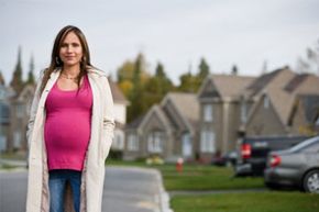 pregnant woman walking in neigborhood