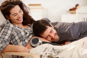 headphones over belly of pregnant woman