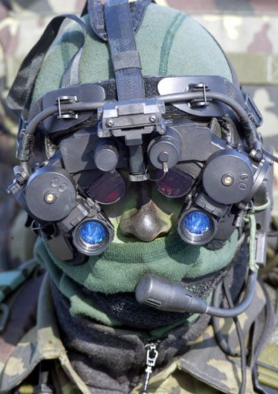 A Czech commando, member of Army's 601st Special Forces Unit, wearing Night Vision Binoculars, provides a training in anti-guerrillas skills.