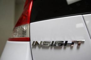 Honda Insight Image Gallery Honda is bringing back the Insight hybrid car, an inexpensive model that still attempts to get drivers good gas mileage. See more pictures of the Honda Insight.