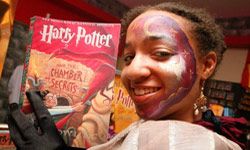 A young fan brandishes her copy of &quot;Harry Potter and the Chamber of Secrets&quot; at the Borders at Time Warner Center in New York City.
