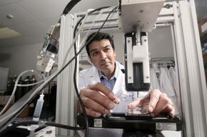Dr. Darryl D'Lima, an orthopedic specialist, works with a bioprinter he helped to develop located in the Shiley Center for Orthopedic Research &amp; Education at Scripps Clinic. D' Lima has enlisted bioprinting in his cartilage regeneration research.
