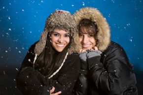 Women wearing warm jackets in the snow