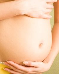 close-up of pregnant Caucasian woman's belly