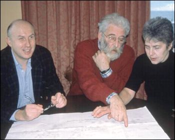 The Merrick and Potterton families held a reunion in Bournemouth, South England. They look over their family tree.