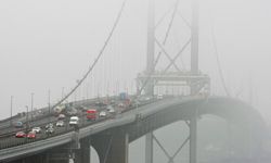 Motorists travel across the Forth Bridge over the Firth of Forth River in Edinburgh, Scotland.