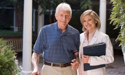 Elderly man and woman outside assisted living facility