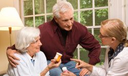 Couple talking with doctor about prescription medicine