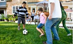 family playing soccer