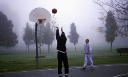 Guys playing basketball