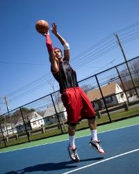 Person shooting from behind three-point line