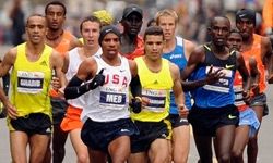 Meb Keflezighi, center, leads the men's field in the New York City borough of Brooklyn during the New York City Marathon, Sunday. Nov. 1, 2009 in New York. Keflezighi became the first American man to win the race since 1982.