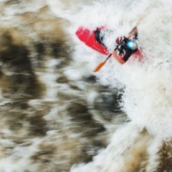 A kayaker takes on an eddy called "Hell Hole" on the Ocoee.”border=