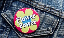 Perhaps you could make flower power buttons for your guests!