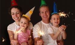 parents and young children celebrating New Year's Eve