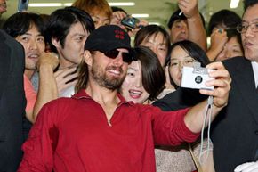Tom Cruise taking a self portrait in Tokyo