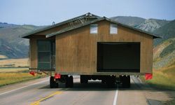 A home being towed on a highway