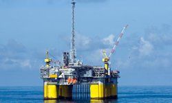 Industry drilling for fuel on offshore platform.