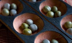 The setup for Mancala is an array of cups -- you can even use an egg carton, if you want to.