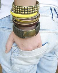 close-up of girl's arm wearing lots of bracelets
