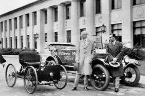 1927: Henry Ford (left) and his son Edsel (right) stand next to the first and the 15-millionth Ford.