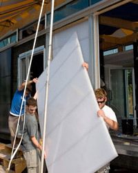 Georgia Tech students install &quot;light walls&quot; on their energy-efficient home displayed at the National Mall's 2007 &quot;Solar Village.&quot;