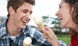 teenagers eating ice cream and laughing