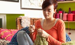 Young woman knitting