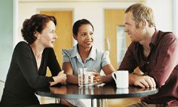 Professionals chatting over coffee