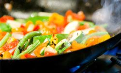 stir-fried vegetables in a wok