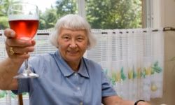 elderly woman toasting