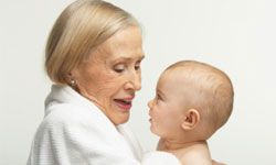 grandmother holding baby