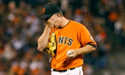 Matt Cain of the San Francisco Giants reacts after giving up a run against the Los Angeles Dodgers during the sixth inning at AT&T Park on July 27, 2012, in San Francisco, Calif. See more Sports Pictures.”width=