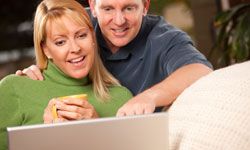 Couple watching TV on laptop