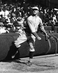 Spitball pitcher Burleigh Grimes of the Brooklyn Robins (now the Los Angeles Dodgers) throws out a pitch as spectators look on during a game at Ebbets Field in Brooklyn, New York, early 1920s.