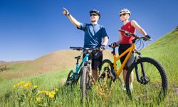 Cycling outdoors with a bicycle and sports helmet.