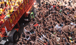 Hoards of people come out for the chance to pelt a tomato at their friends and neighbors.