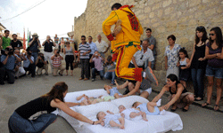 El Colacho clears a mattress full of babies.