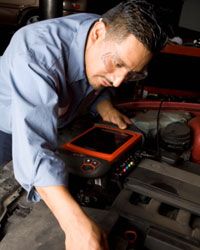 Using a diagnostic computer, a mechanic can view a car's digitally stored information and determine exactly what the problem is.