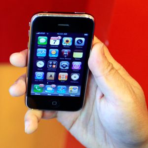 An iPhone user holds his phone in Palo Alto, Calif.