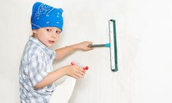 boy cleaning wall