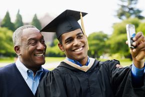 College graduate with father.